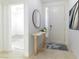 Bright entryway featuring a console table with decor, tiled floors, and a clear view of the front door at 10742 Cowlite Ave, Las Vegas, NV 89166