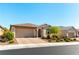 Charming home featuring a well-manicured front yard, a two-car garage, and a lovely entry way at 10742 Cowlite Ave, Las Vegas, NV 89166