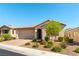 A charming single-story home with low-maintenance landscaping and a brick driveway at 10742 Cowlite Ave, Las Vegas, NV 89166