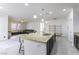 The open-concept kitchen has granite counters, a large island with seating, and stainless steel appliances at 10742 Cowlite Ave, Las Vegas, NV 89166