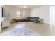 Bright living room has lots of natural light, tile flooring, and comfortable seating at 10742 Cowlite Ave, Las Vegas, NV 89166