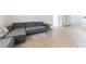 Open living area with tile flooring flows seamlessly from the kitchen, featuring a comfortable sectional sofa at 10742 Cowlite Ave, Las Vegas, NV 89166