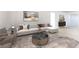 Bright living room features stylish decor with an L-shaped sofa, patterned rug, and elegant accents at 10742 Cowlite Ave, Las Vegas, NV 89166