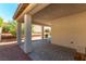 Comfortable covered patio with brick flooring and a quaint outdoor seating area, perfect for outdoor enjoyment at 10742 Cowlite Ave, Las Vegas, NV 89166