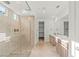 Modern bathroom with tiled walk-in shower, dual sink vanity, and sleek fixtures at 10851 Hanwicke Harbor Ave, Las Vegas, NV 89166