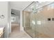 Beautiful bathroom featuring a tiled walk-in shower, a rainfall shower head, and a sleek vanity at 10851 Hanwicke Harbor Ave, Las Vegas, NV 89166