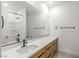 Bathroom features a long countertop, large mirror, and bronze fixtures at 10851 Hanwicke Harbor Ave, Las Vegas, NV 89166