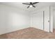 Bedroom with neutral carpet, white walls, a ceiling fan, and a closet at 10851 Hanwicke Harbor Ave, Las Vegas, NV 89166