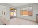 Bright dining area with light wood floors, large windows, and access to an outdoor covered patio at 10851 Hanwicke Harbor Ave, Las Vegas, NV 89166