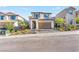 Charming two-story home featuring neutral colored exterior, red tile roof, and two car garage at 10851 Hanwicke Harbor Ave, Las Vegas, NV 89166