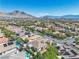 Majestic aerial perspective capturing a home's desirable location, surrounded by green spaces and majestic mountain views at 11621 La Mirago Pl, Las Vegas, NV 89138