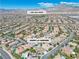 Stunning aerial view pinpointing 11621 La Mirage within a vibrant community, set against a backdrop of scenic mountain views at 11621 La Mirago Pl, Las Vegas, NV 89138