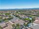 Scenic aerial view of a home situated in a vibrant community with lush greenery and neighborhood amenities at 11621 La Mirago Pl, Las Vegas, NV 89138