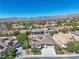 Breathtaking aerial view of home with mountain views and mature landscaping within a sprawling residential community at 11621 La Mirago Pl, Las Vegas, NV 89138
