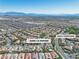 Aerial shot showcases home's location in a community nearby North Tower Park with mountain views at 11621 La Mirago Pl, Las Vegas, NV 89138