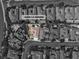An aerial, black and white view of a home with precise property line and address in the surrounding community at 11621 La Mirago Pl, Las Vegas, NV 89138