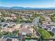 Picturesque aerial view of a beautiful home nestled in a well-planned community, complemented by mountain vistas at 11621 La Mirago Pl, Las Vegas, NV 89138