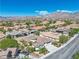 Aerial view of home in a community with lush landscaping, mountain views, and convenient street access at 11621 La Mirago Pl, Las Vegas, NV 89138