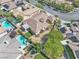 Overhead shot of a lovely residence featuring manicured landscaping, a sparkling pool, and a serene outdoor living space at 11621 La Mirago Pl, Las Vegas, NV 89138