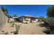 Landscaped backyard featuring decorative rock and small plants at 11621 La Mirago Pl, Las Vegas, NV 89138