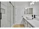 Bathroom featuring a white vessel sink, black hardware, and glass enclosed shower at 11621 La Mirago Pl, Las Vegas, NV 89138
