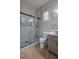 Modern bathroom featuring a glass-enclosed shower and stylish vanity at 11621 La Mirago Pl, Las Vegas, NV 89138
