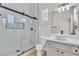 Bright bathroom features a glass enclosed shower with black hardware and a vessel sink at 11621 La Mirago Pl, Las Vegas, NV 89138