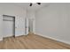 Bedroom with wood floors, neutral paint, ceiling fan and closet space at 11621 La Mirago Pl, Las Vegas, NV 89138