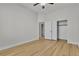 Bedroom with wood floors, neutral paint, ceiling fan and closet space at 11621 La Mirago Pl, Las Vegas, NV 89138
