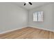 Bedroom features wood floors, neutral paint, ceiling fan, and white shutters at 11621 La Mirago Pl, Las Vegas, NV 89138