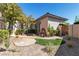 Front courtyard featuring low-maintenance landscaping, a stone walkway, and an eye-catching water feature at 11621 La Mirago Pl, Las Vegas, NV 89138