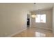 Dining area with travertine floors and modern chandelier at 11621 La Mirago Pl, Las Vegas, NV 89138