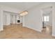 Dining area with modern chandelier and view to the kitchen at 11621 La Mirago Pl, Las Vegas, NV 89138