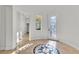 Bright foyer with decorative tiled floor, high ceilings, and ornate glass entry door at 11621 La Mirago Pl, Las Vegas, NV 89138