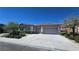 Attractive single-story home with a three-car garage and well-maintained landscaping at 11621 La Mirago Pl, Las Vegas, NV 89138