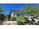 Charming single-story home with arched window, shutters, and lush landscaping at 11621 La Mirago Pl, Las Vegas, NV 89138
