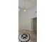 Elegant foyer featuring a decorative tile medallion and tall ceilings at 11621 La Mirago Pl, Las Vegas, NV 89138