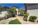 Charming single-story home with a landscaped front yard and inviting walkway to the front door at 11621 La Mirago Pl, Las Vegas, NV 89138