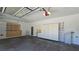 Organized garage with storage cabinets, shelving, and ample space for parking and projects at 11621 La Mirago Pl, Las Vegas, NV 89138