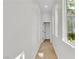 Bright hallway featuring neutral walls and tiled flooring leading to other rooms at 11621 La Mirago Pl, Las Vegas, NV 89138