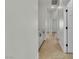 Hallway with tile floors, white walls, baseboards, doors, and countertops at 11621 La Mirago Pl, Las Vegas, NV 89138