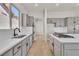 Bright kitchen featuring stainless steel appliances and ample counter space at 11621 La Mirago Pl, Las Vegas, NV 89138
