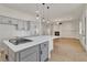 Beautiful kitchen with a large island, modern appliances, and gray cabinets at 11621 La Mirago Pl, Las Vegas, NV 89138