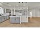 Stylish kitchen island with cooktop, sleek cabinets and ample counter space at 11621 La Mirago Pl, Las Vegas, NV 89138