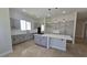 Contemporary kitchen boasting gray cabinets, quartz countertops, and stainless steel appliances at 11621 La Mirago Pl, Las Vegas, NV 89138