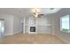 Spacious living room with tile floors, fireplace, and large windows for ample natural light at 11621 La Mirago Pl, Las Vegas, NV 89138