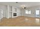 Spacious living room with tile flooring, a modern fireplace, and plenty of natural light at 11621 La Mirago Pl, Las Vegas, NV 89138