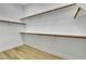 Walk-in closet with wooden clothing racks at 11621 La Mirago Pl, Las Vegas, NV 89138