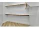 Walk-in closet with wooden clothing racks at 11621 La Mirago Pl, Las Vegas, NV 89138