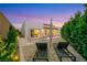 Backyard view with modern lounge chairs, a pool and lovely landscaping at 11895 Skyline Arch Ct, Las Vegas, NV 89138